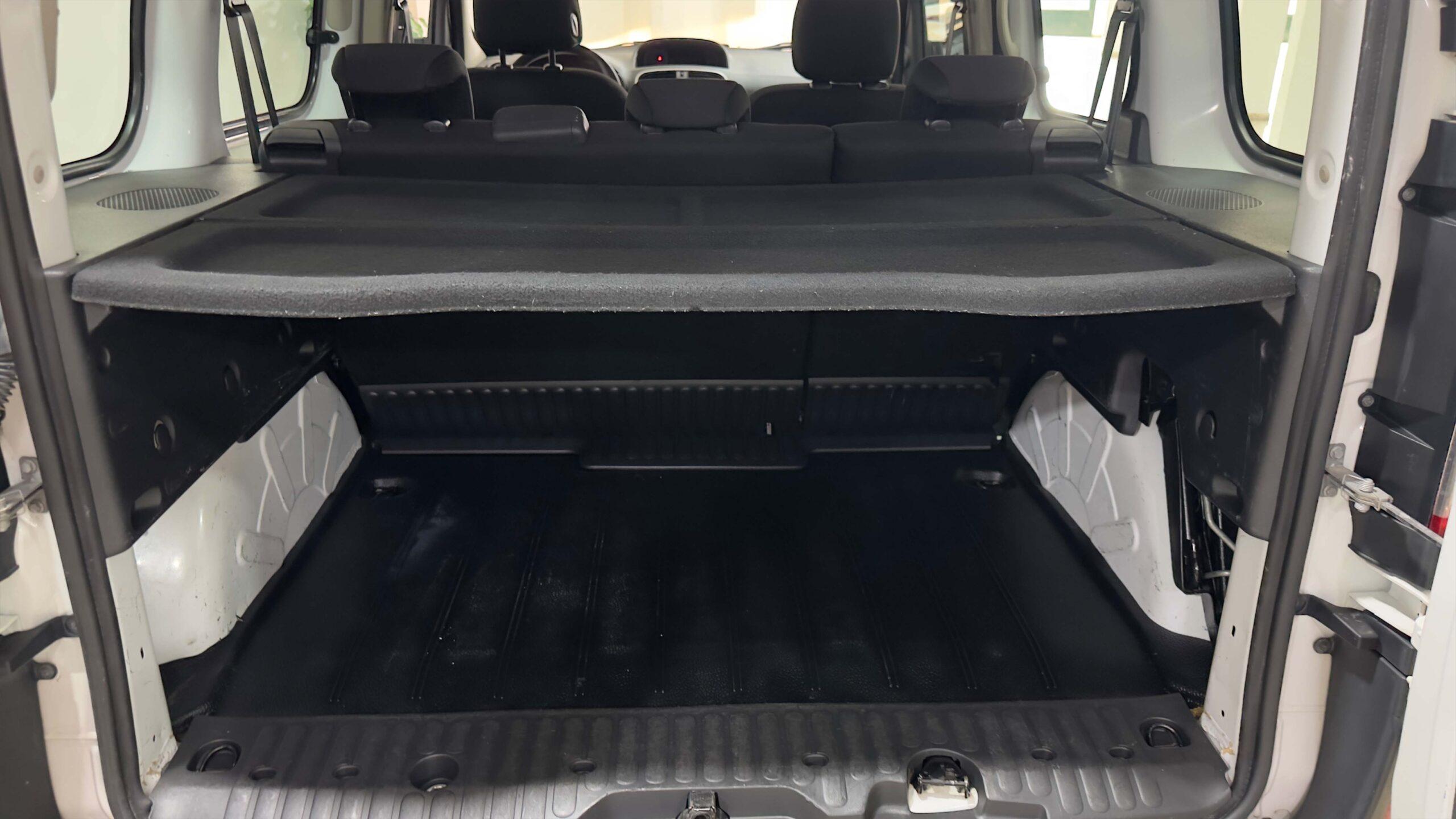 The headlights and the hood of a black luxury car