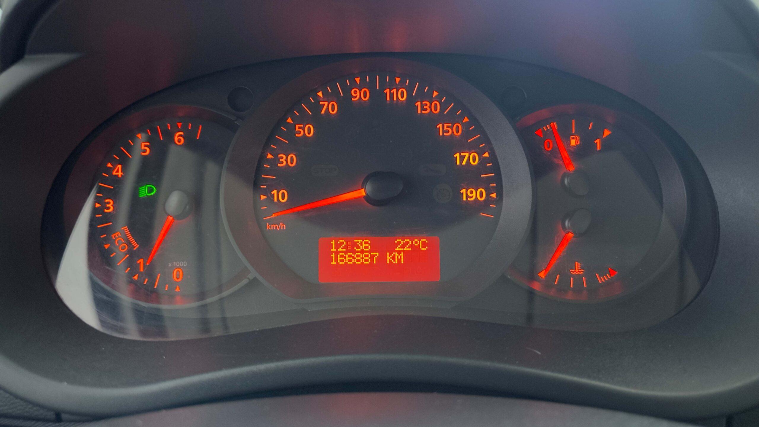 The headlights and the hood of a black luxury car