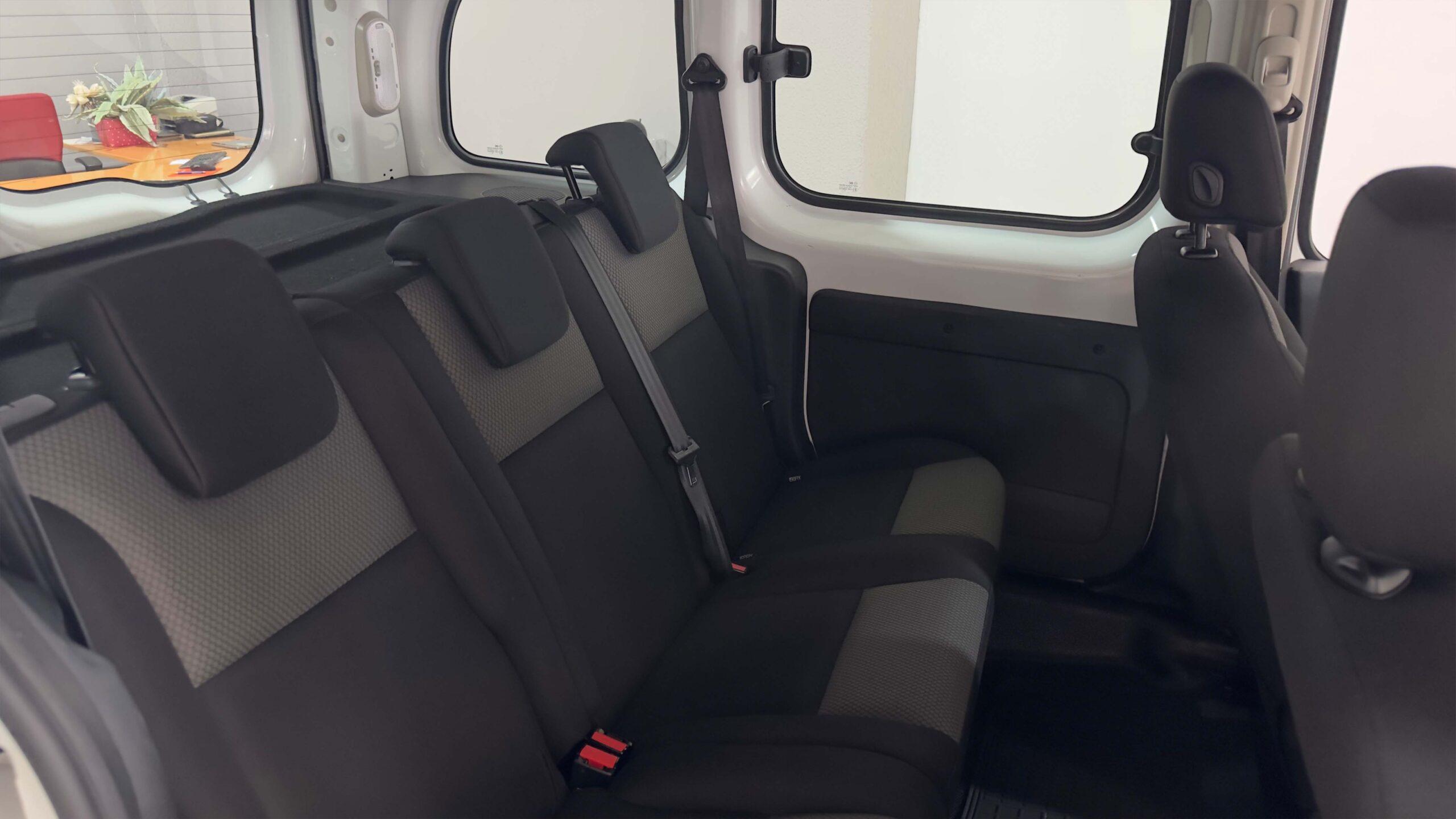 The headlights and the hood of a black luxury car