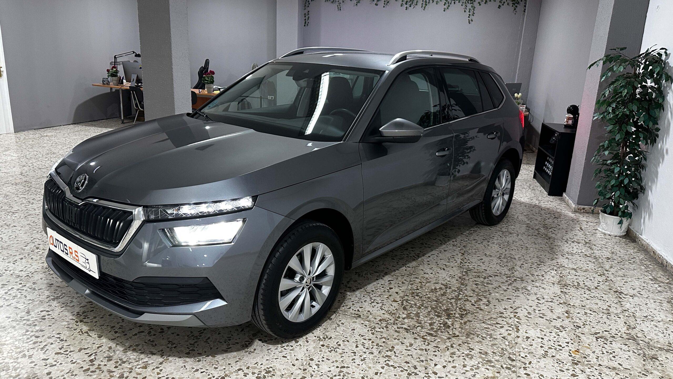 The headlights and the hood of a black luxury car