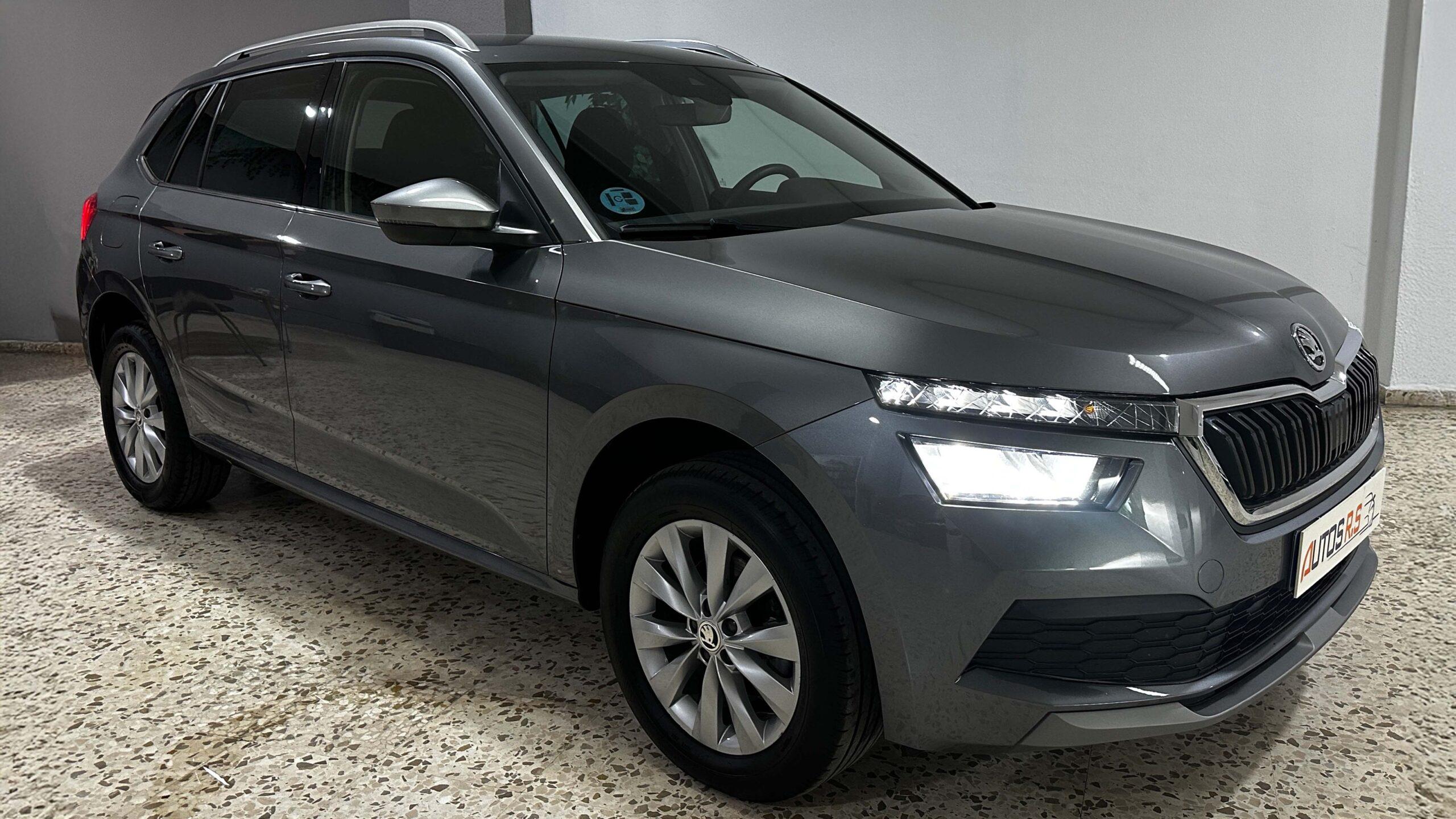 The headlights and the hood of a black luxury car