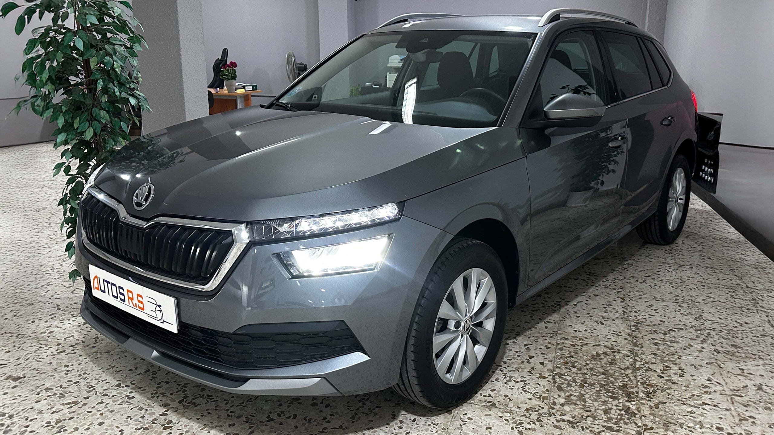 The headlights and the hood of a black luxury car