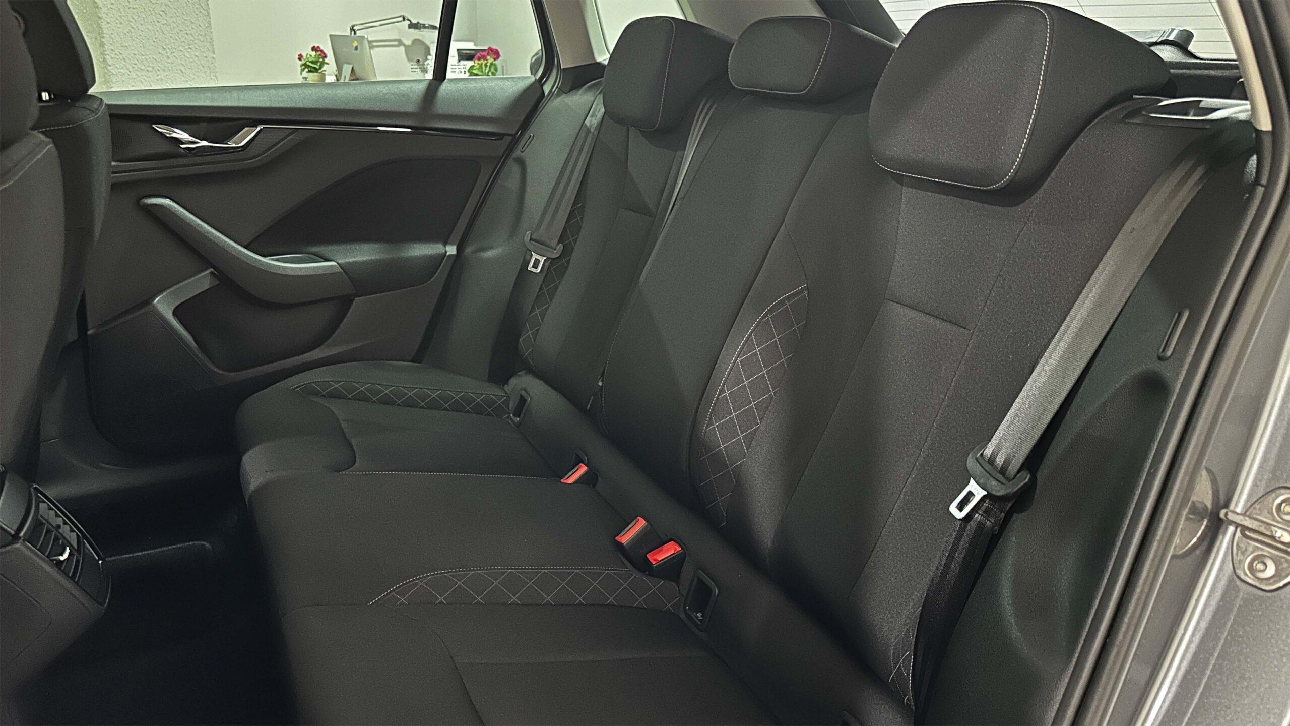 The headlights and the hood of a black luxury car