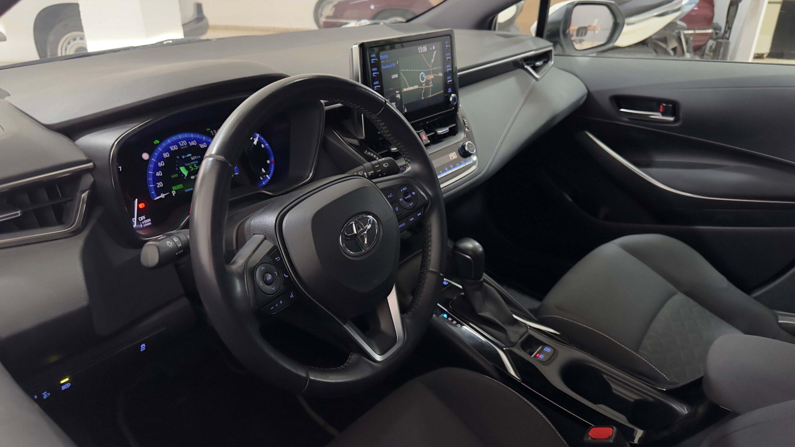 The headlights and the hood of a black luxury car