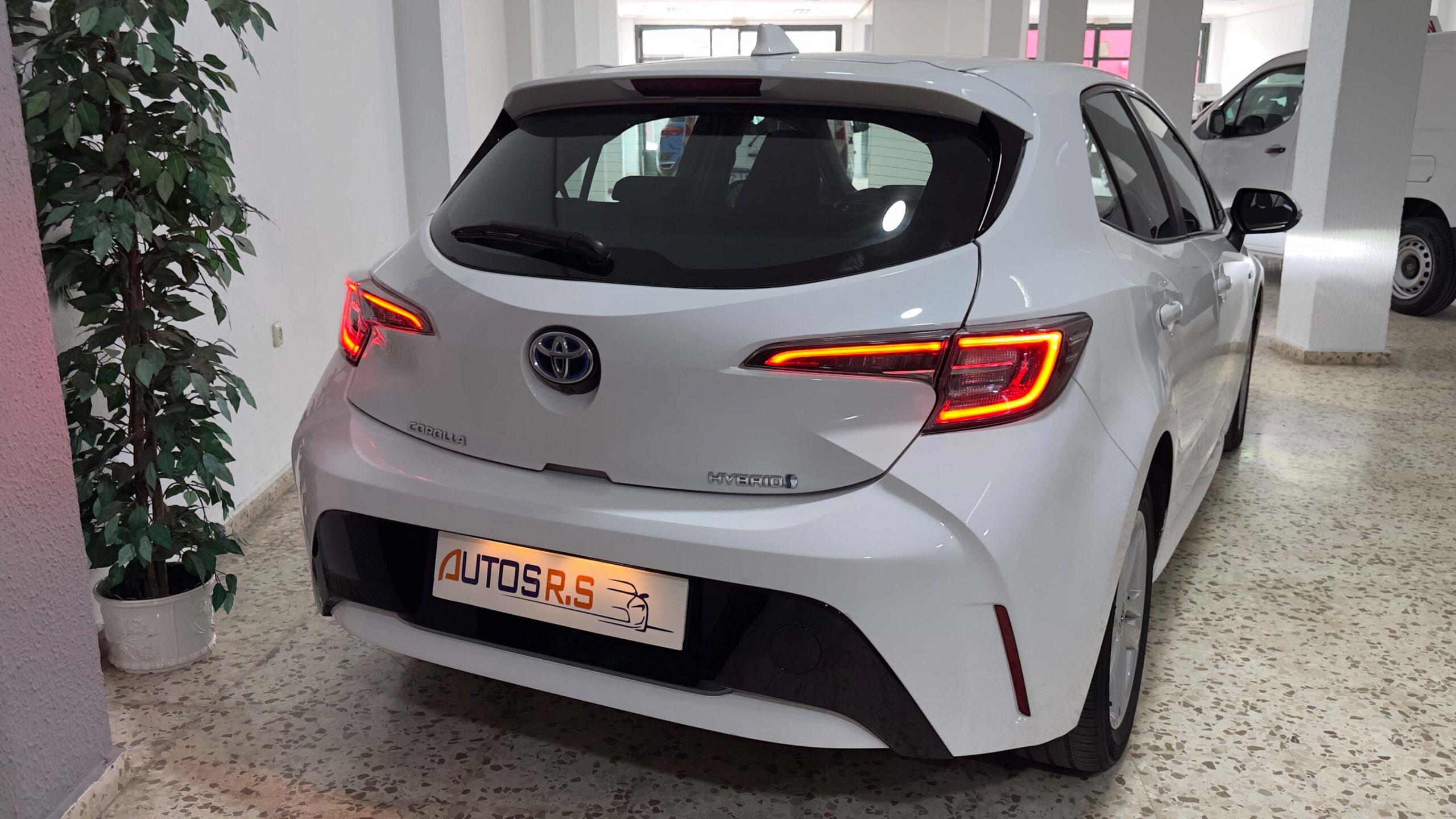 The headlights and the hood of a black luxury car