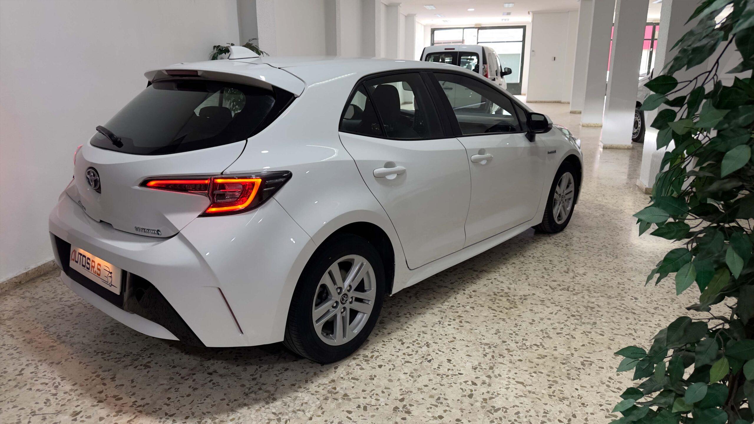 The headlights and the hood of a black luxury car