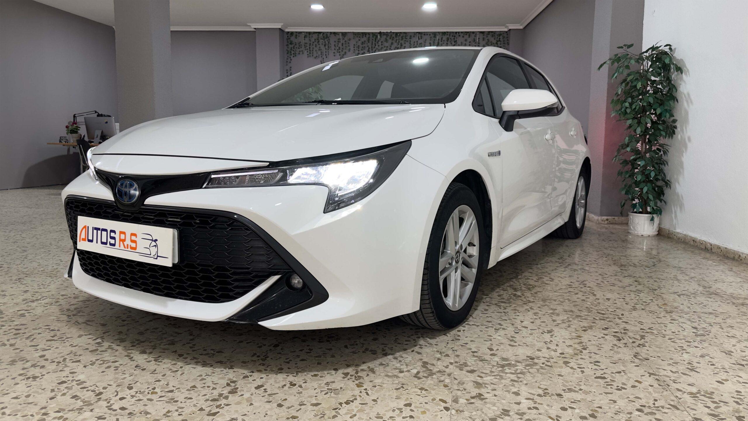 The headlights and the hood of a black luxury car