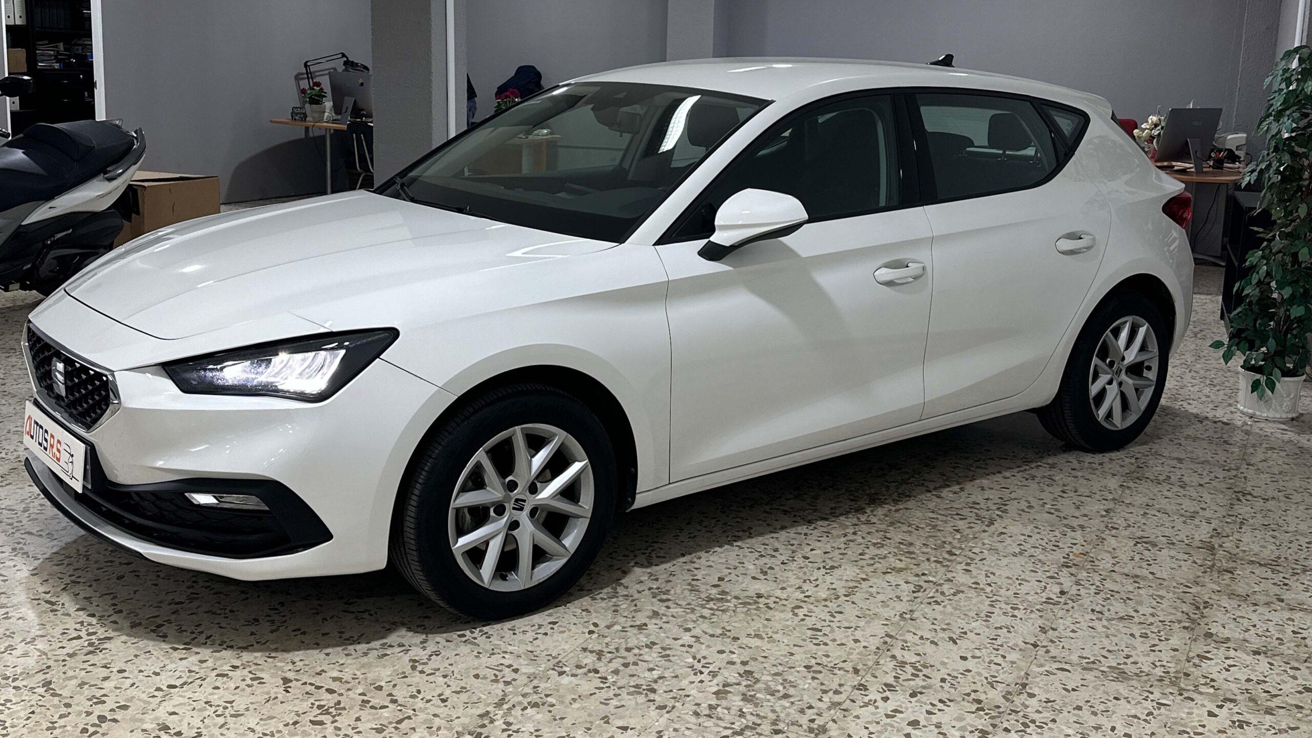 The headlights and the hood of a black luxury car