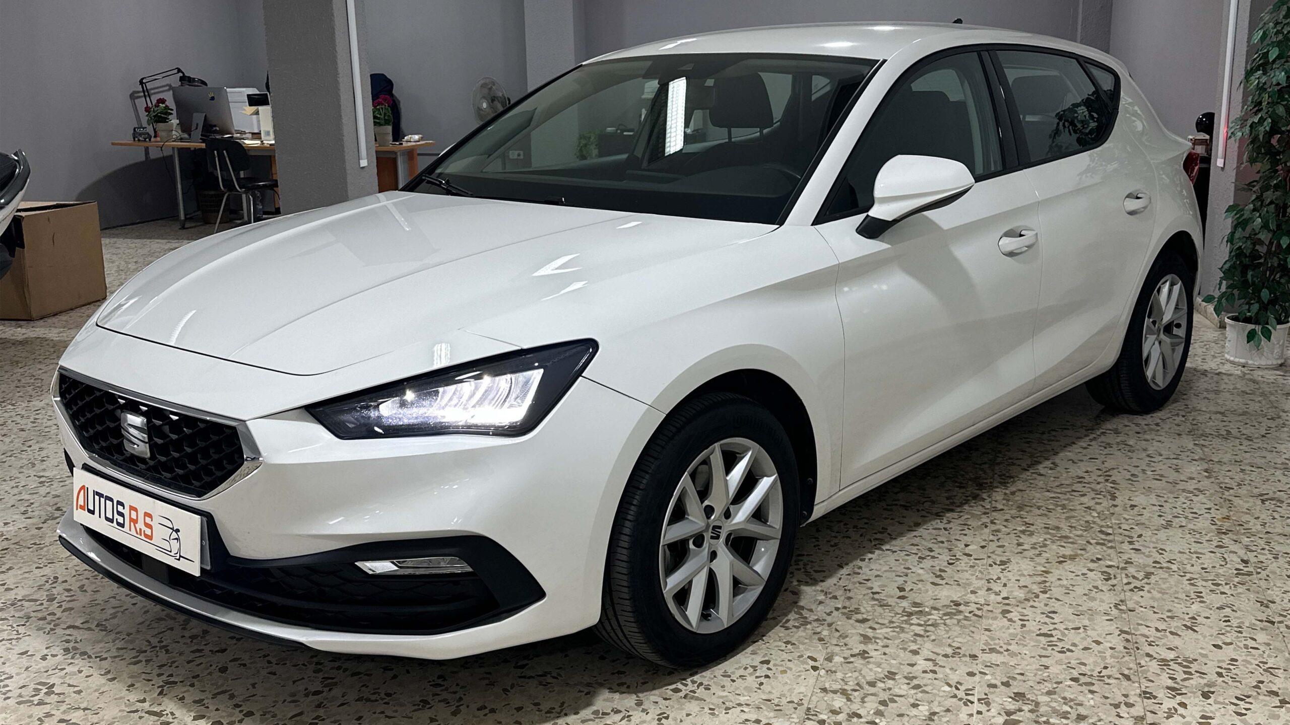 The headlights and the hood of a black luxury car