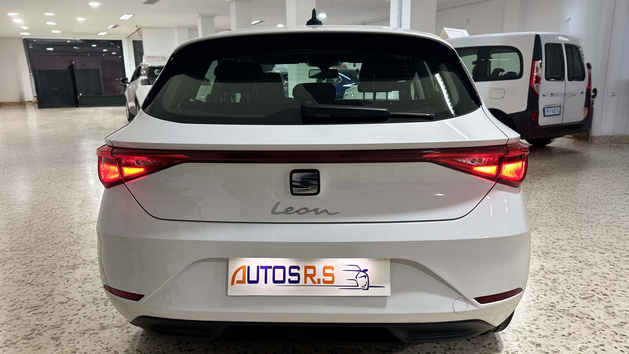 The headlights and the hood of a black luxury car