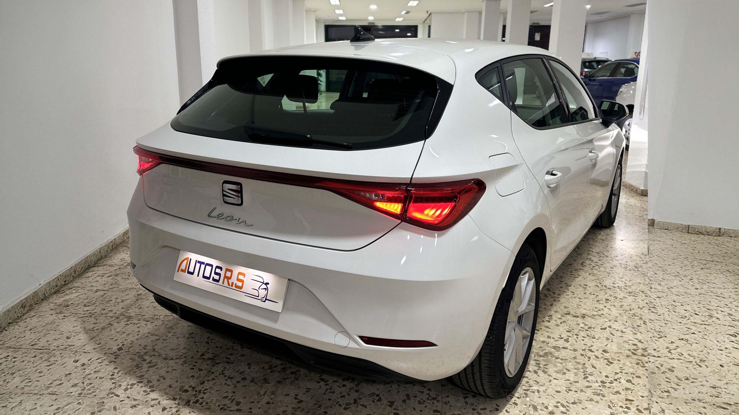 The headlights and the hood of a black luxury car