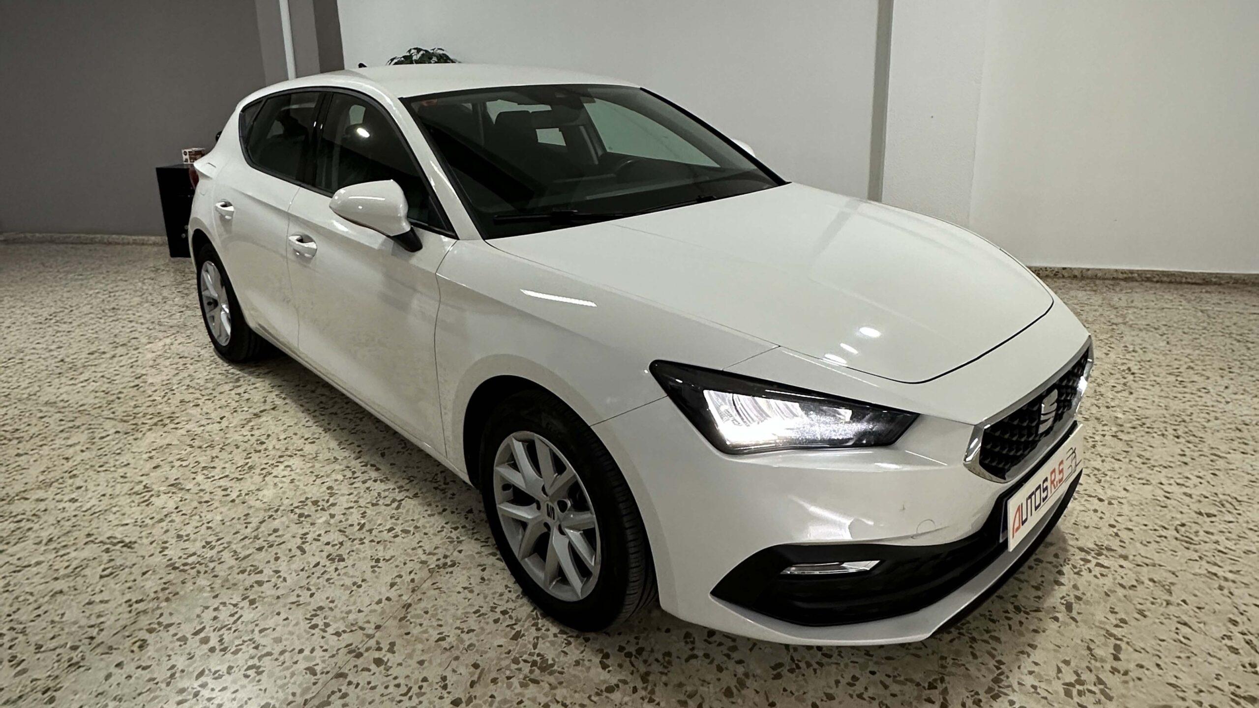 The headlights and the hood of a black luxury car