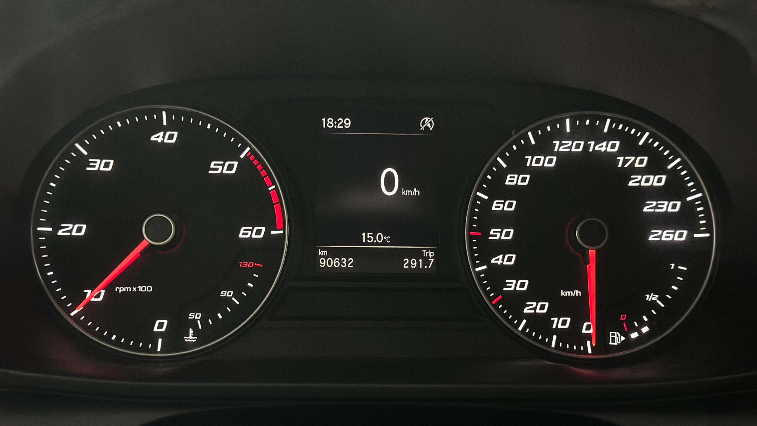 The headlights and the hood of a black luxury car