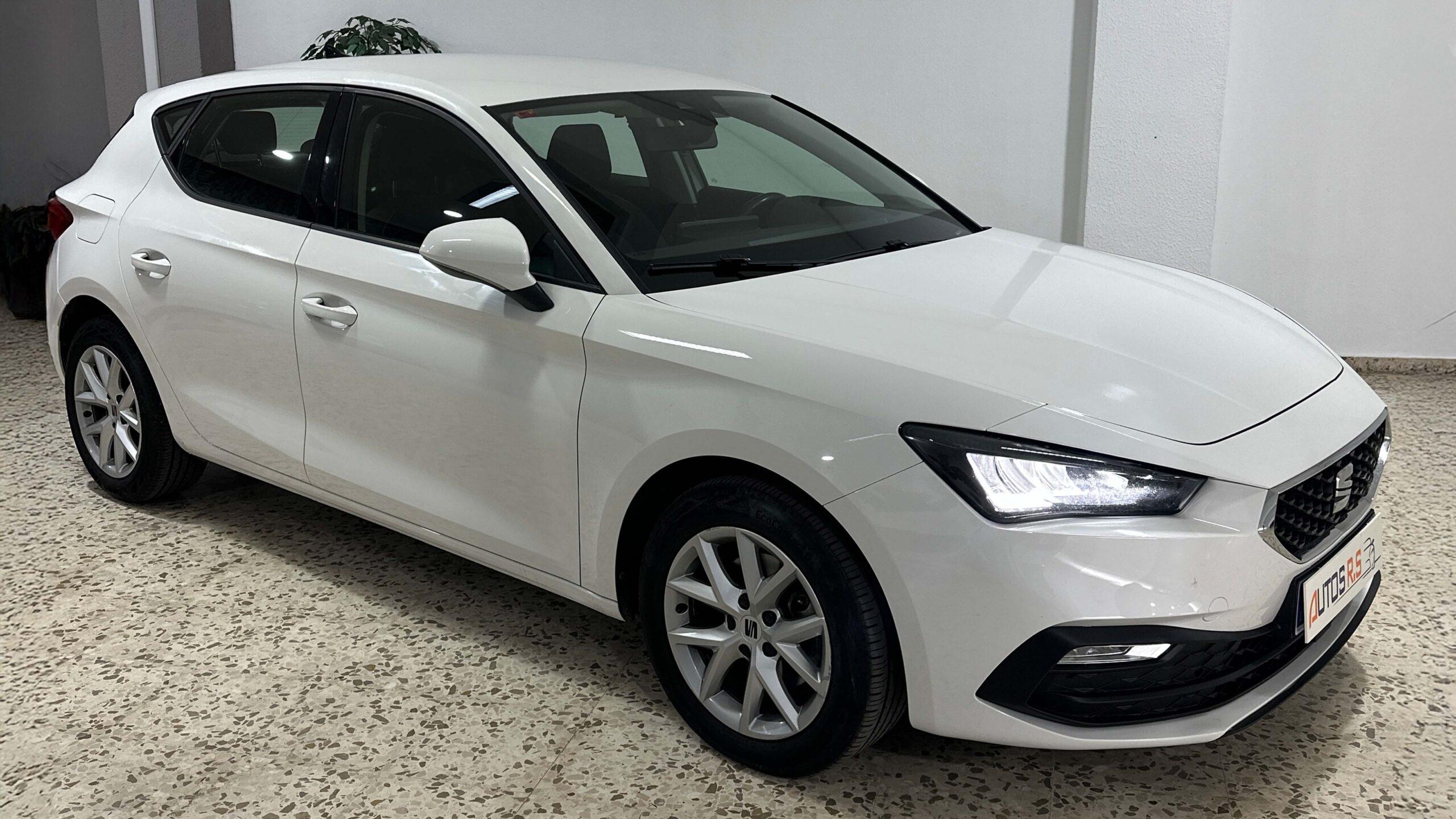 The headlights and the hood of a black luxury car